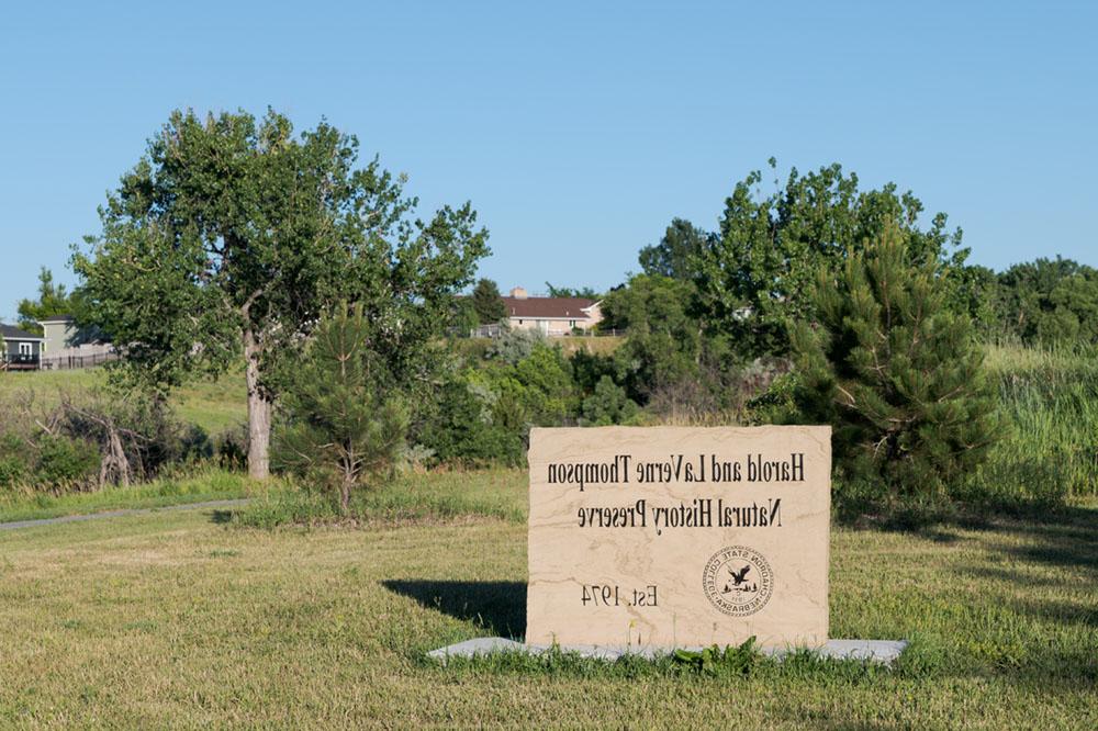 Entrance sign and trees at the Thompson Preserve